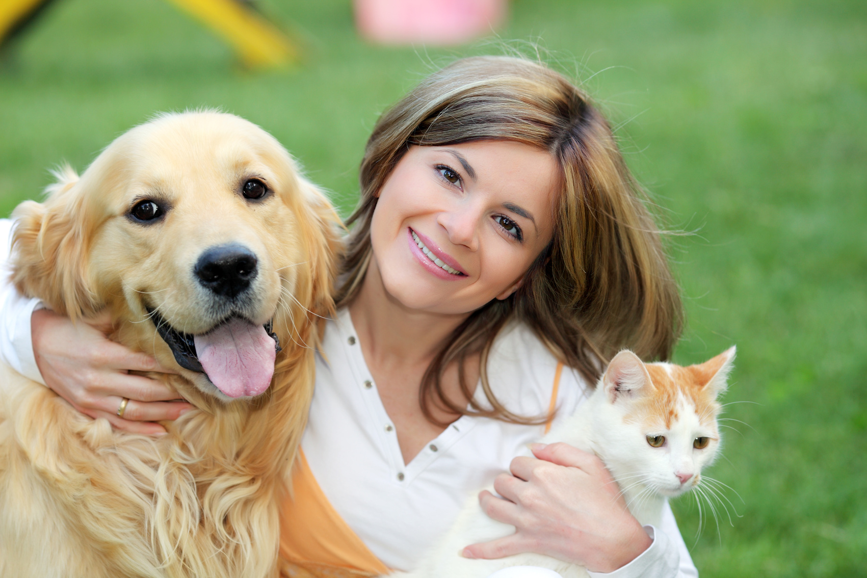 Young woman with dog and cat